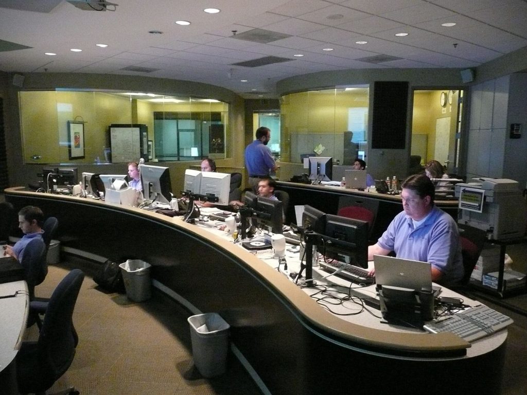 Analysts Take a Closer Role in Triaging AI-Flagged Alerts cybersecurity analyst monitoring multiple screens