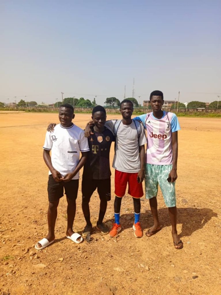 young players training on sports field